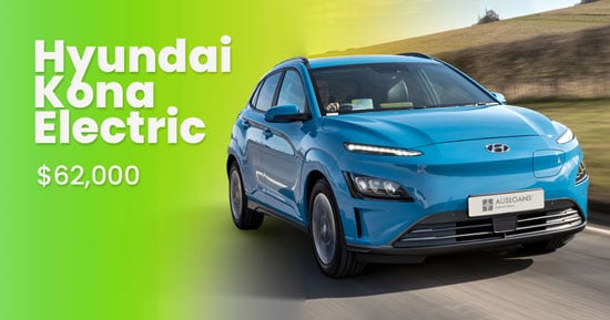 Hyundai Kona Electric on the road with its price written next to it