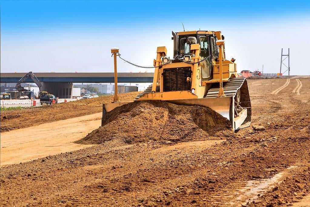 dozer_aggregate_spreading_road