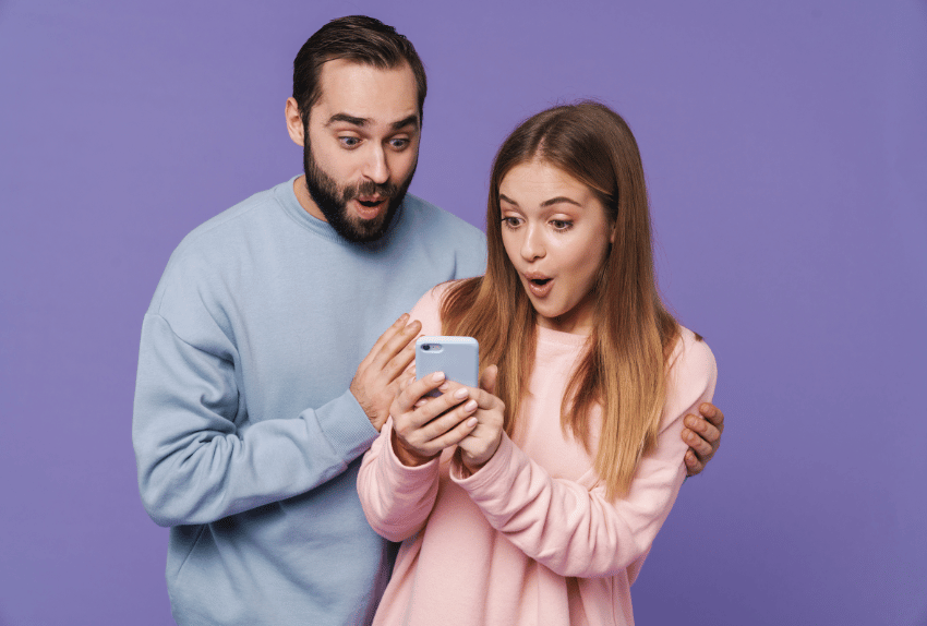 excited couple looking at their borrowing power to purchase a new car after using the car loan borrowing power calculator