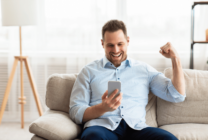 happy man looking at his new weekly repayments after using the car loan refinance calculator